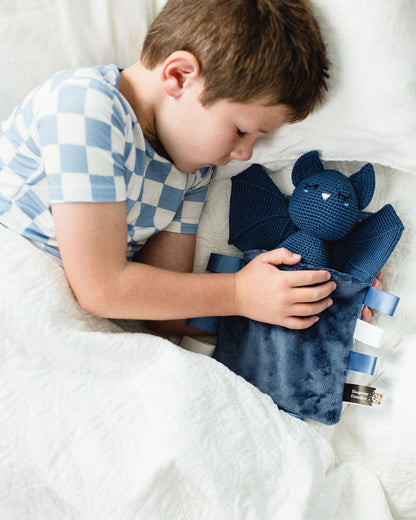 Bat in bedtime sleeping bag with bedtime checklist